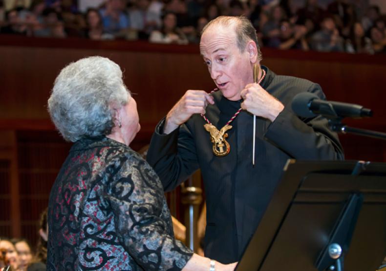 Larry Rachleff, Rice's Walter Kris Hubert Professor of Orchestral Conducting and ACMHF inductee, was recognized at the Oct. 5 orchestra concert by Marie Speziale, a board member for the ACMHF and a Rice professor emerita of trumpet. Photo by Tommy LaVergne.