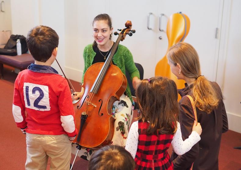 Student showcasing her cello during the school's Family Concert