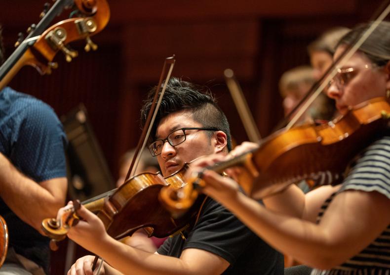 Students from the Shepherd School Symphony Orchestra rehearse with Guest Conductor, Patrick Summers.