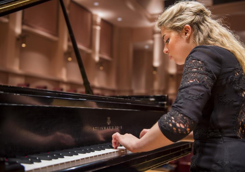 Student playing piano