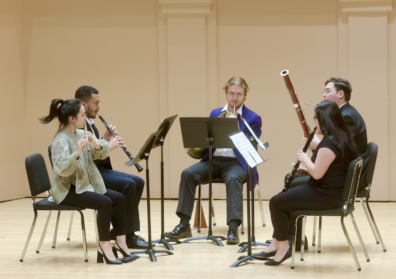 Woodwind quintet performing chamber music