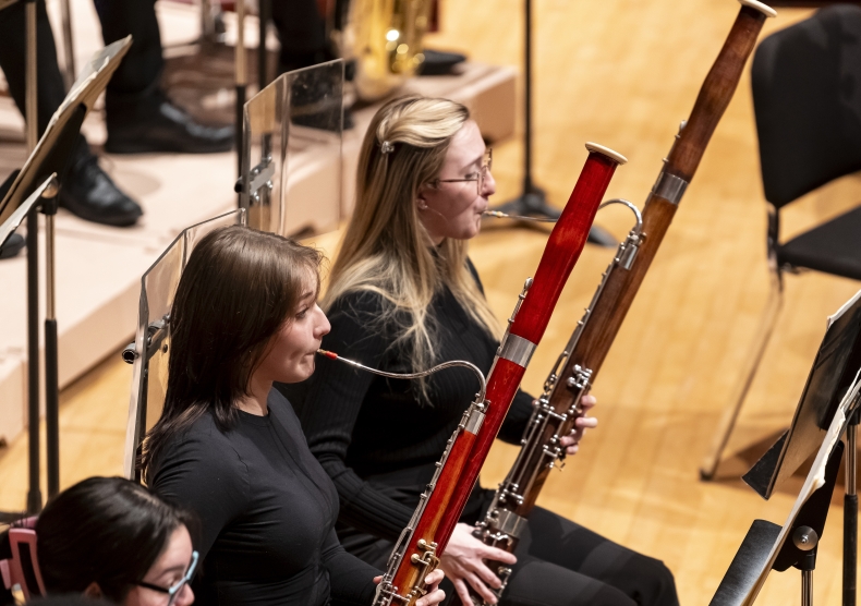 Two bassoonists performing in a Shepherd School Symphony Orchestra concert