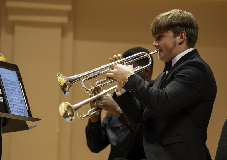 Trumpet player performs in brass chamber group