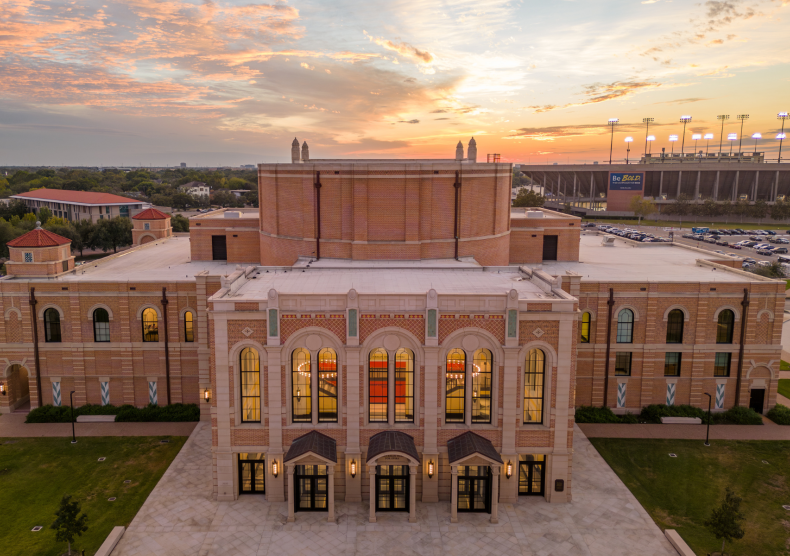 Front facade of Brockman Hall for Opera at sunset