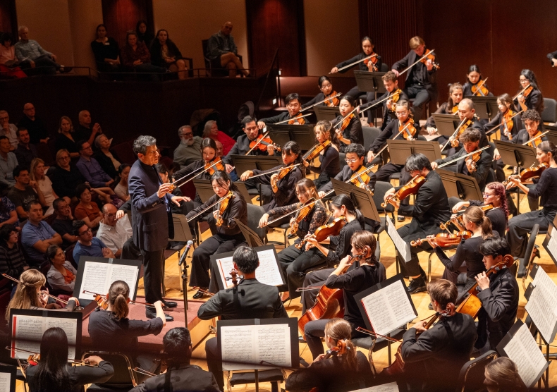 Miguel Harth-Bedoya conducts the Shepherd School Symphony Orchestra featuring the violin section and the backs of the cellists
