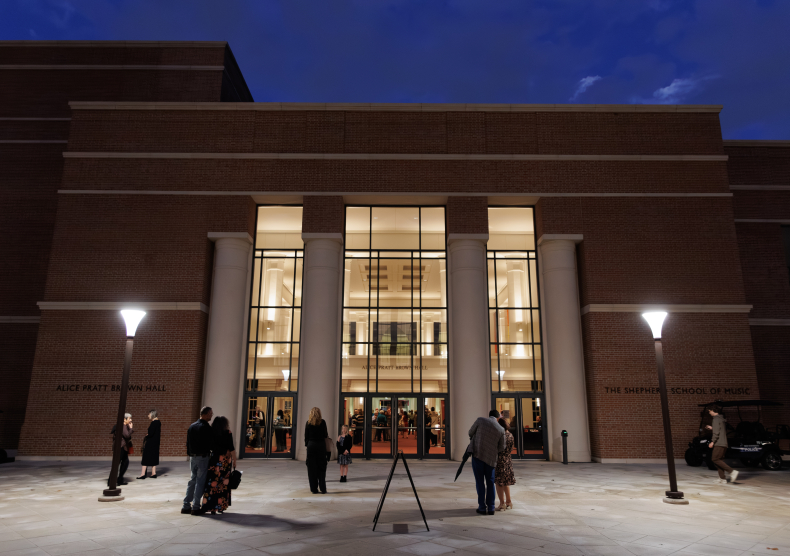 Outside of Alice Pratt Brown Hall as concertgoers walk into attend evening concert
