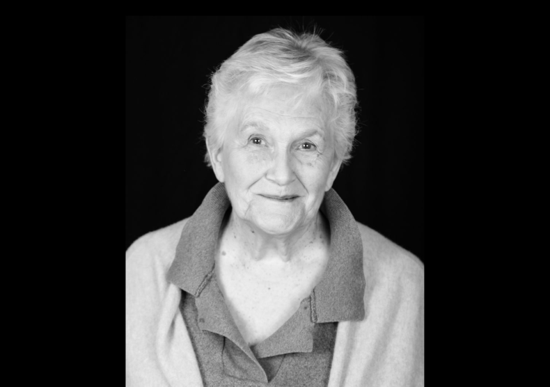 Headshot of Joyce Farwell on black background