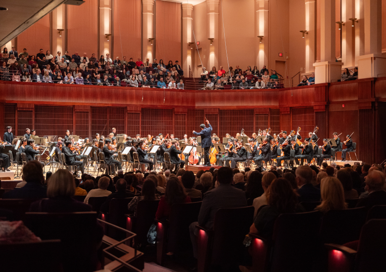 Audience in a sold-out concert in Stude Concert Hall watch the Shepherd School Symphony Orchestra perform