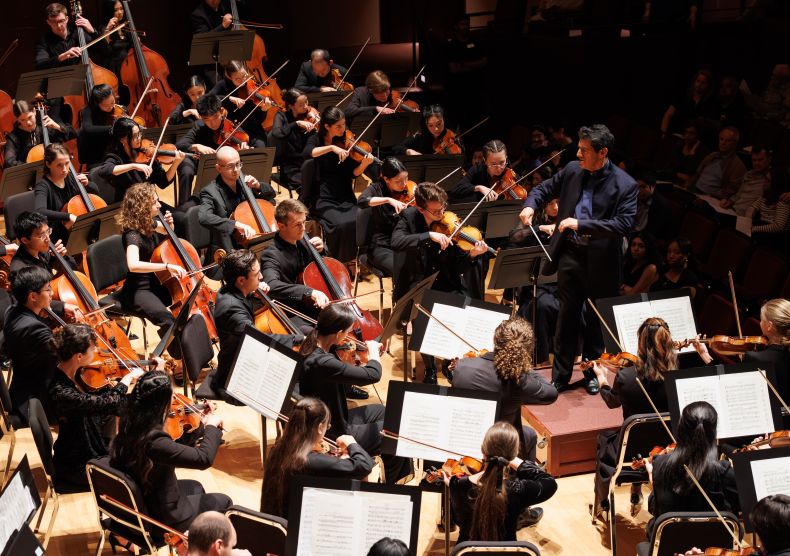 Miguel Harth-Bedoya conducts the Shepherd School Symphony Orchestra featuring the violin section and the backs of the cellists